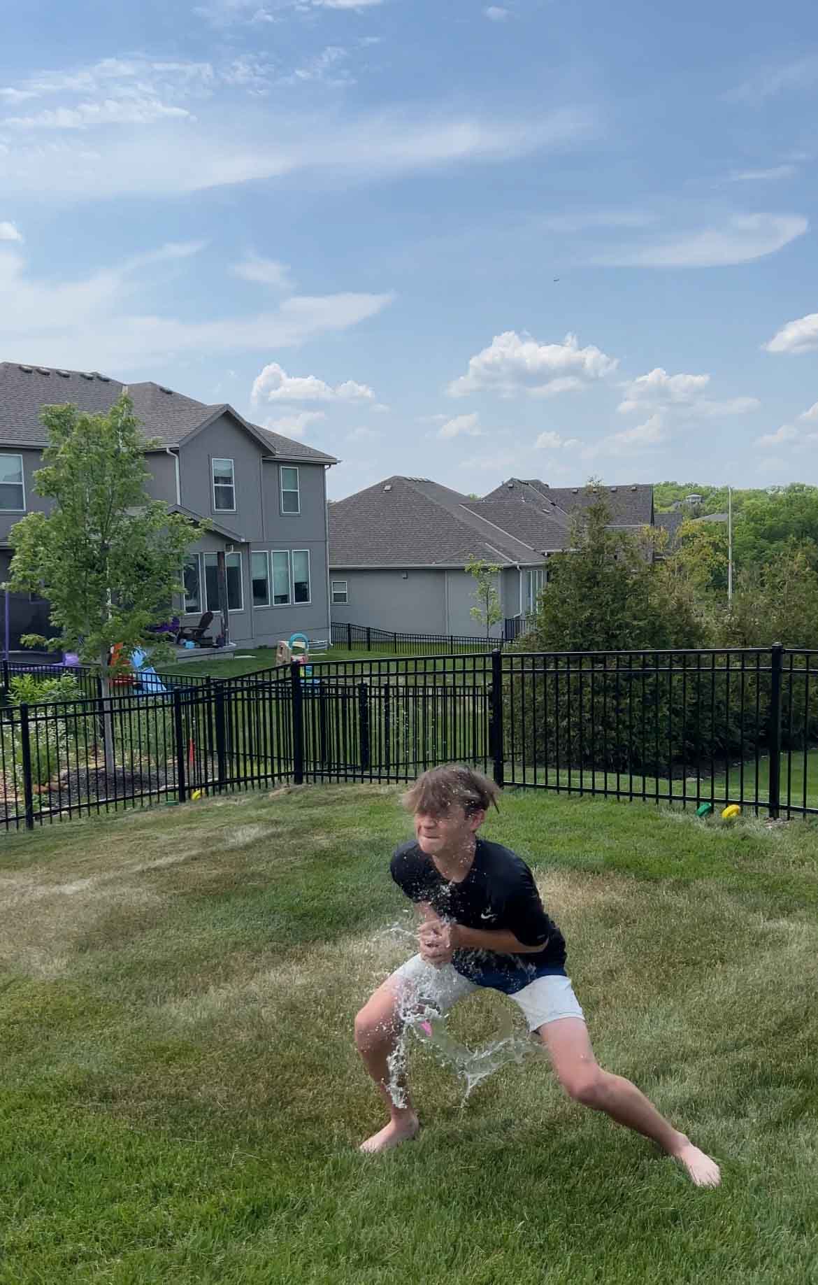 kid catching a balloon that breaks 