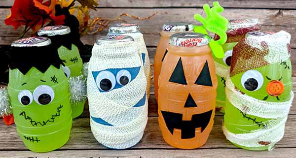 juice bottles decorated as various Halloween characters