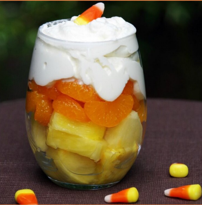 fruit parfait stacked in candy corn pattern