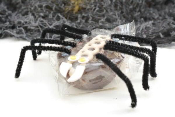 Snack cake with pipe cleaner legs and face to look like a spider