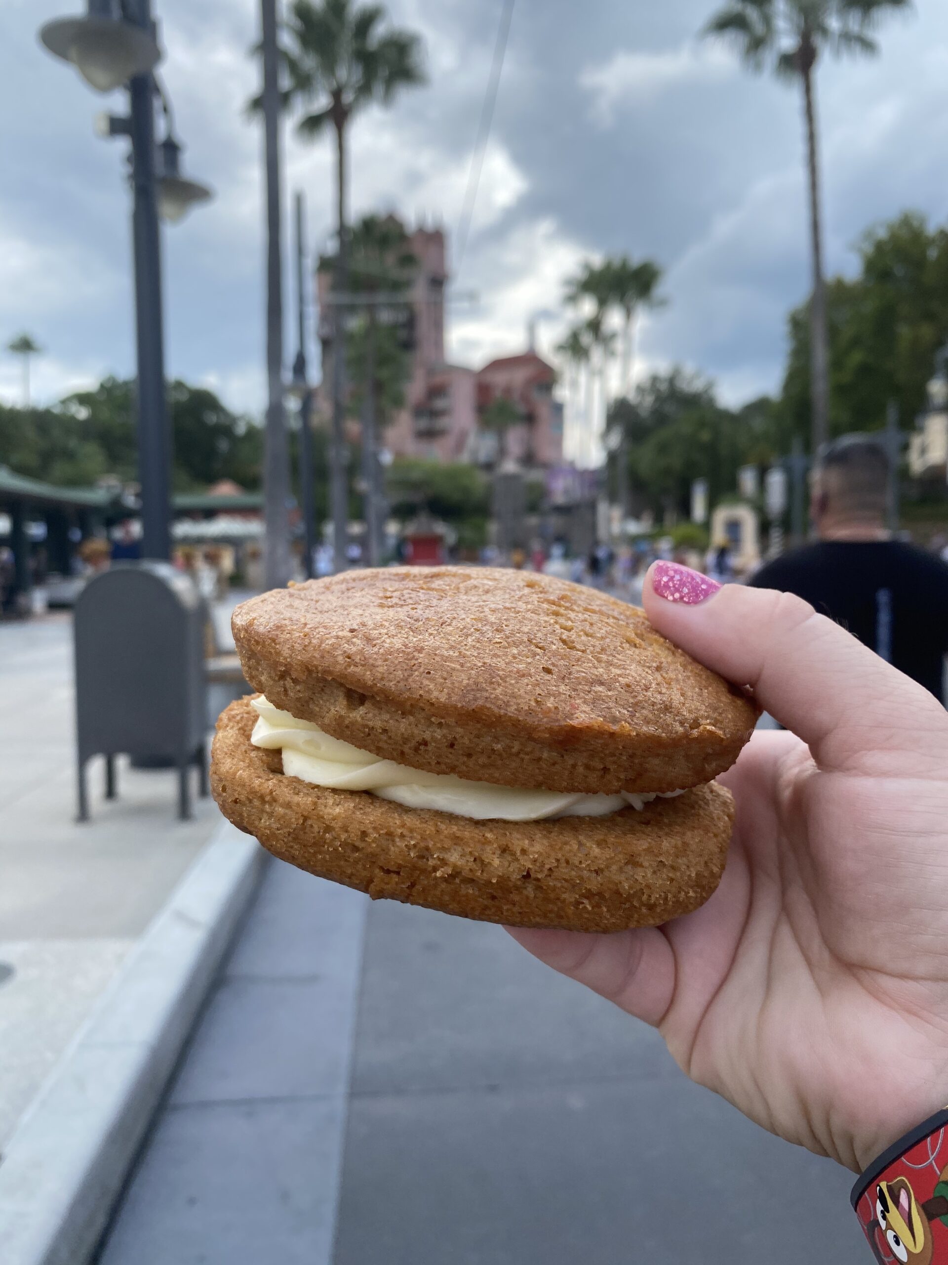 hand holding a carrot cake cookie at Disney World