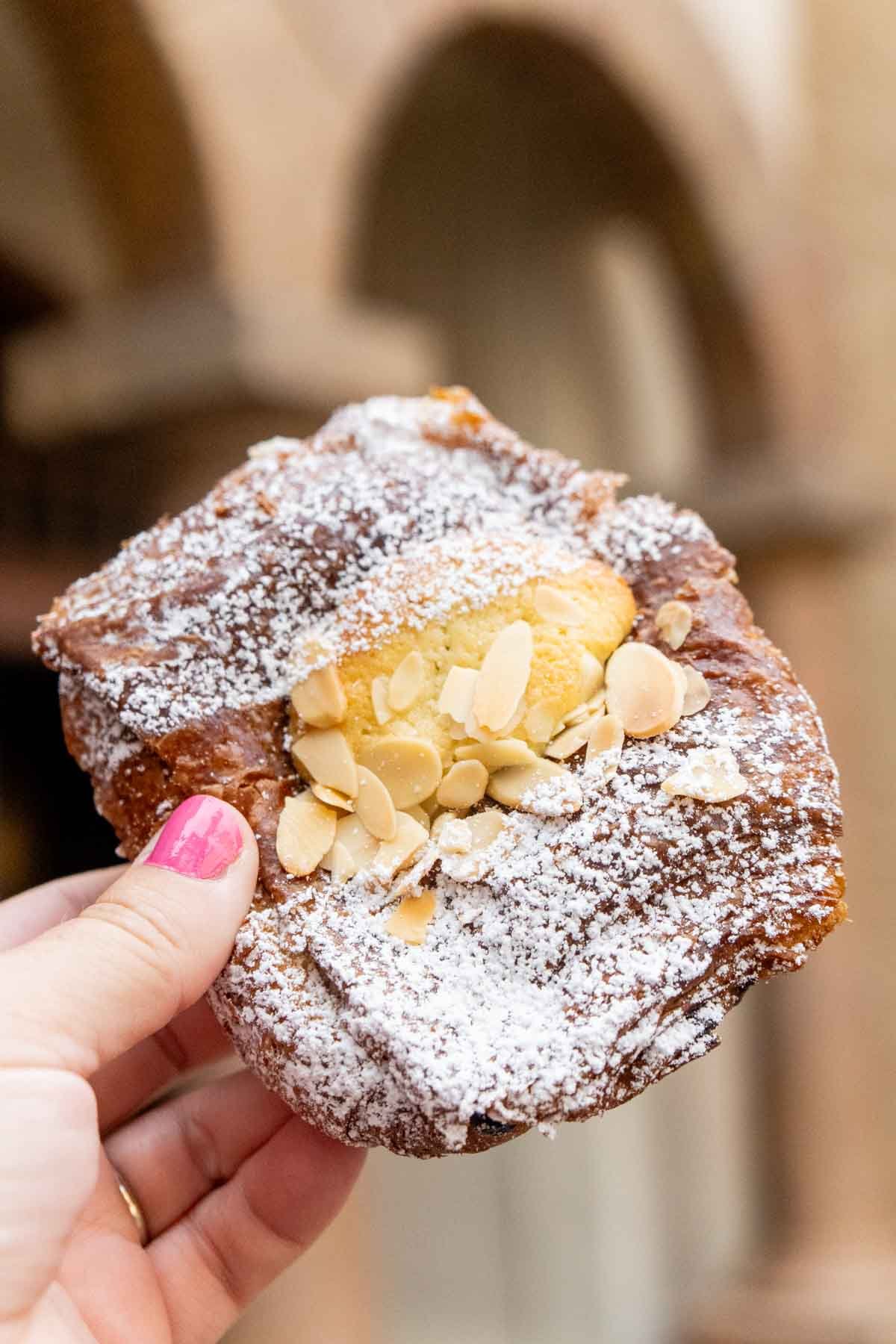 almond croissant from Epcot in a woman's hand