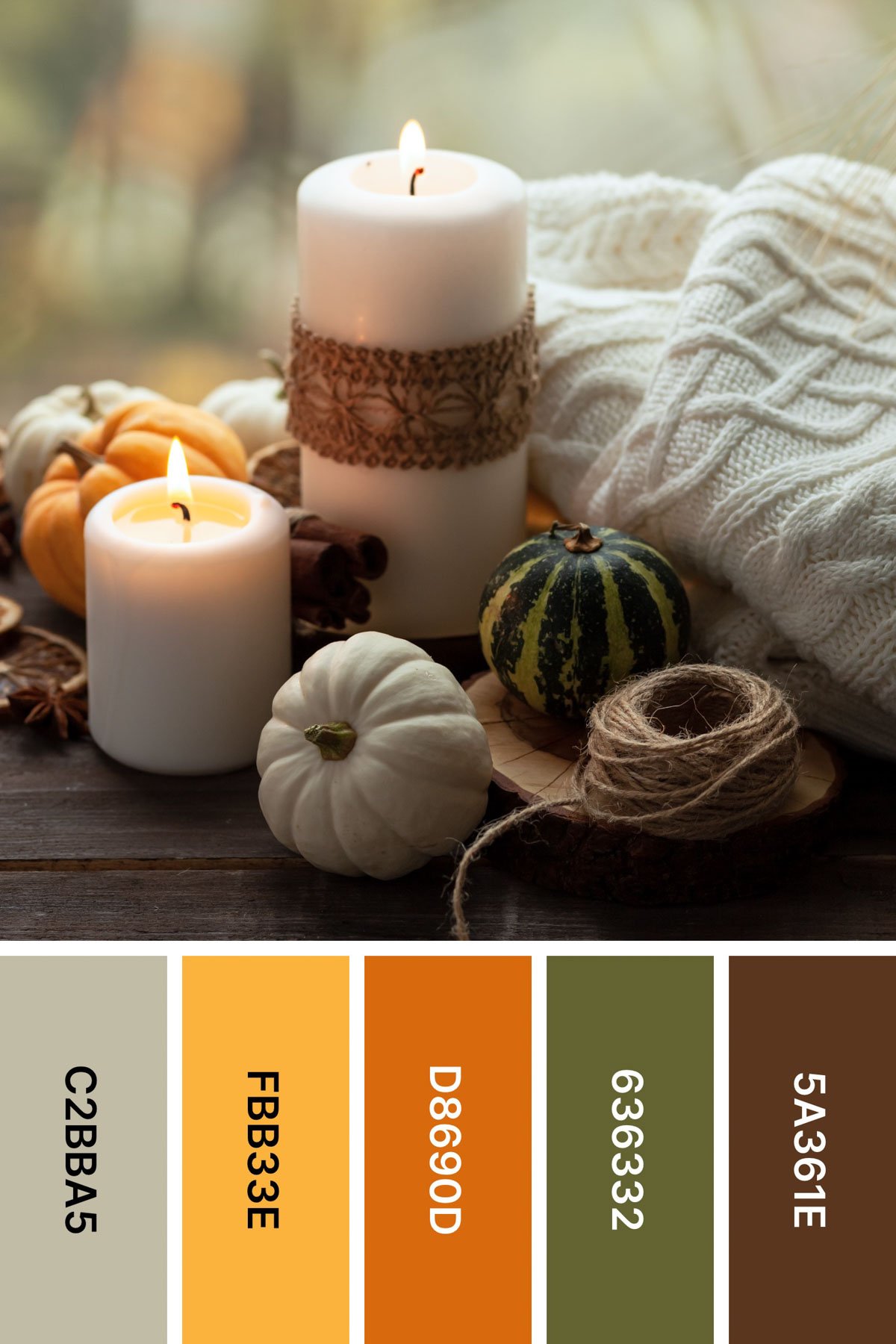 white sweater and candles in a picture with a fall color palette under