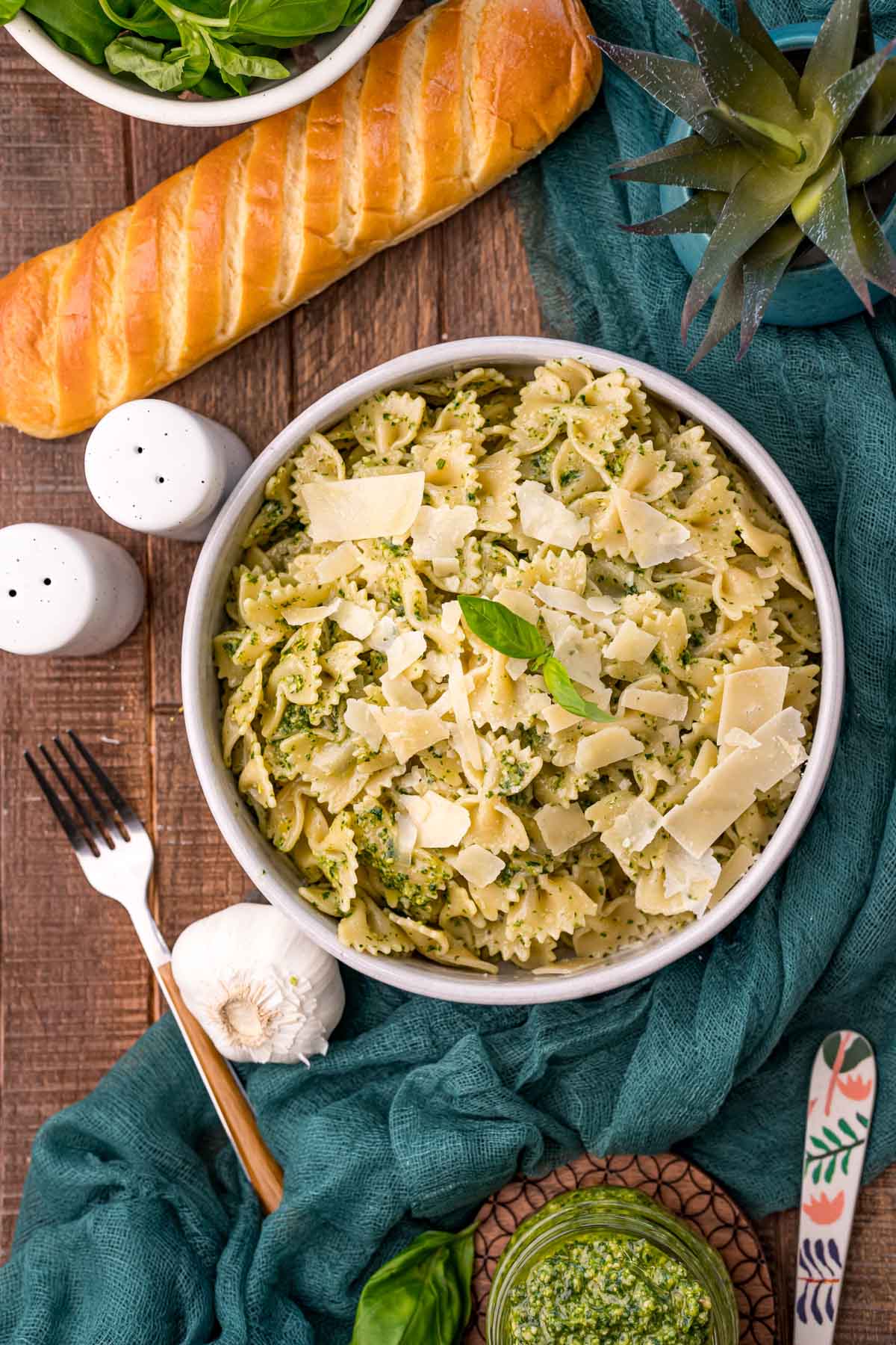 top down view of a creamy pesto pasta dish