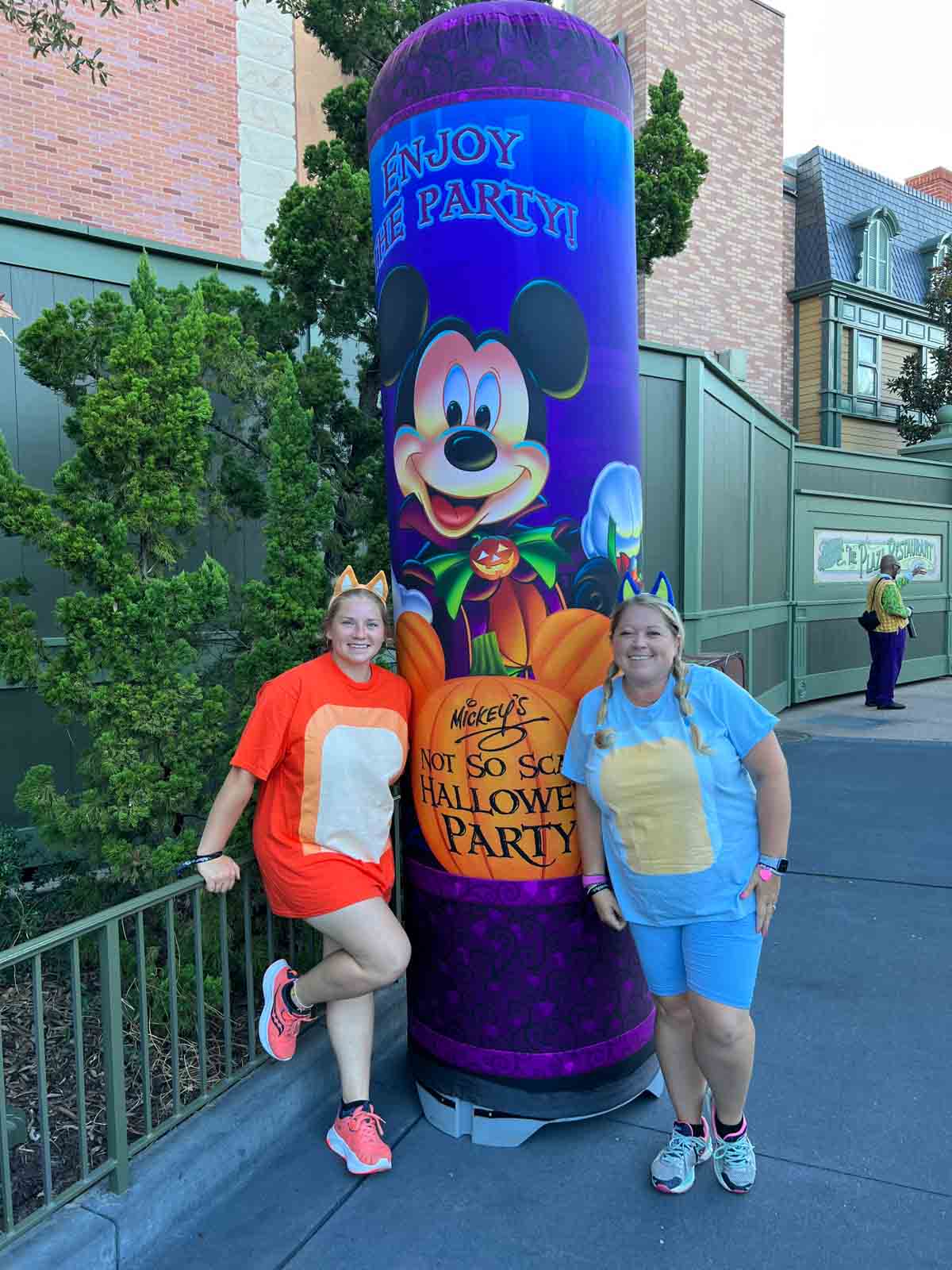 two sisters dressed up at Mickey's Not So Scary Halloween party