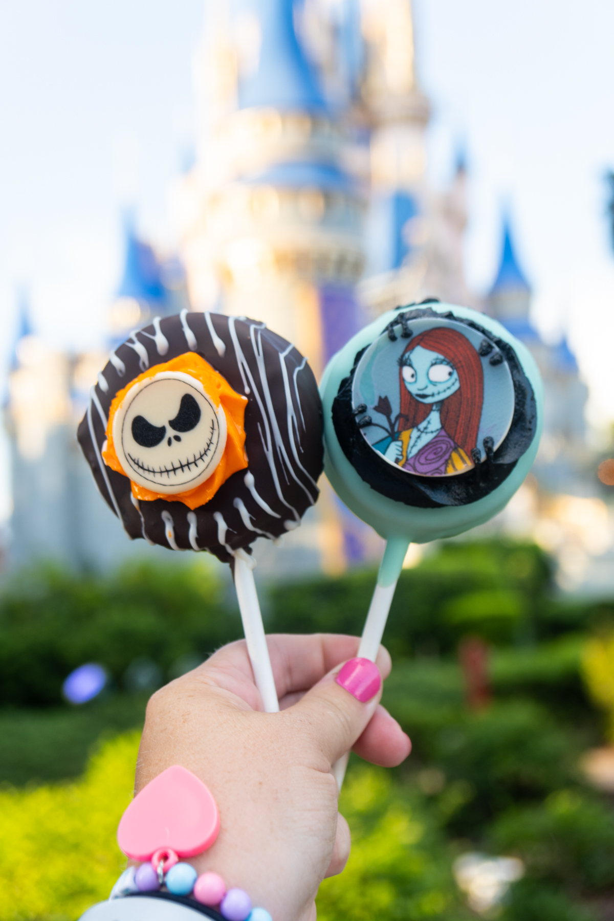 hand holding jack and sally cake pops