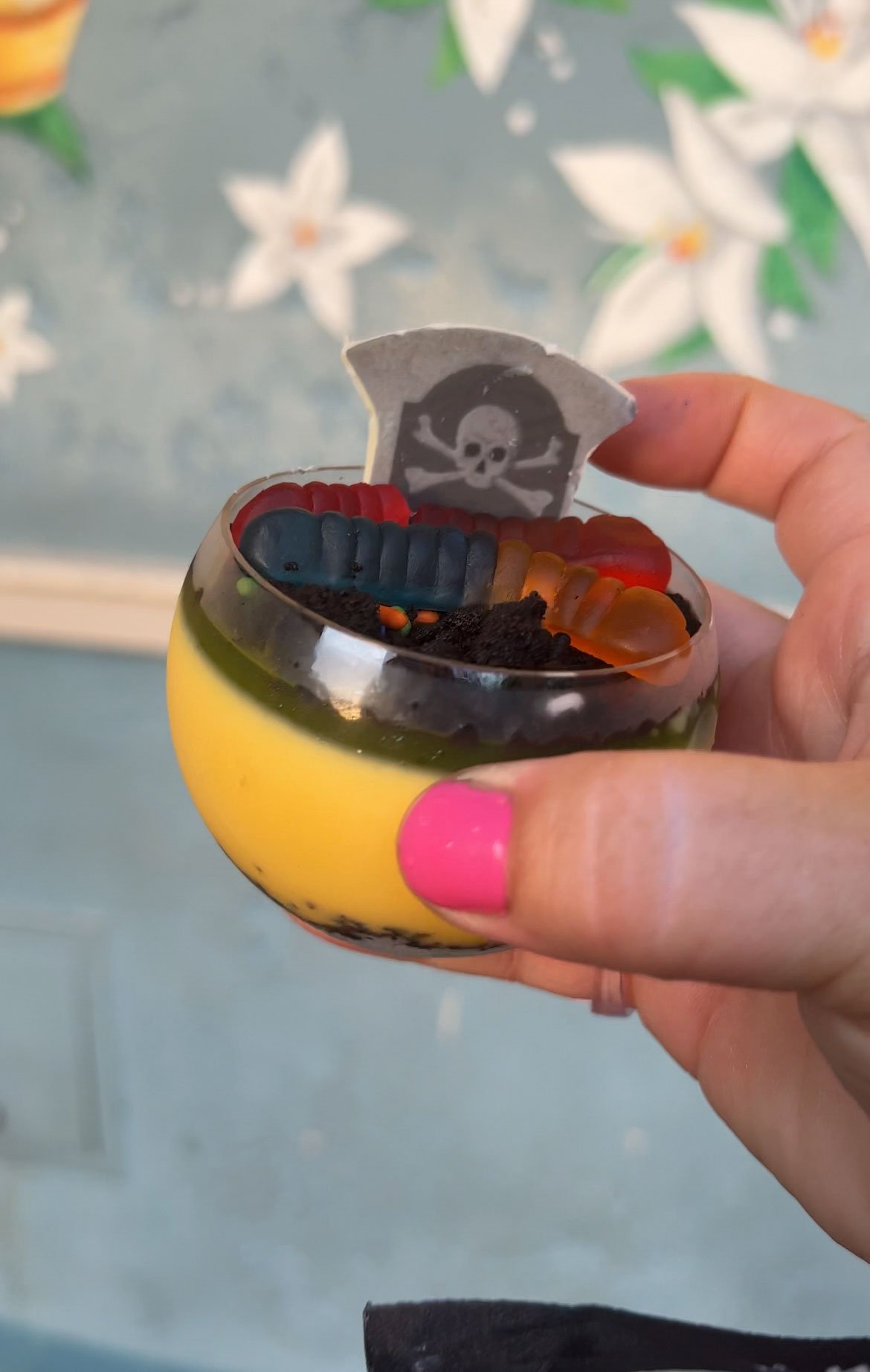 hand holding a tropical dessert at Magic Kingdom