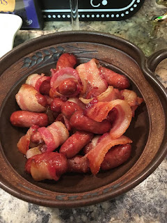 bowl of lil smokies with bacon to resemble toes