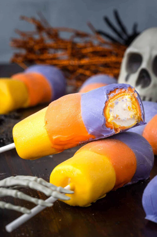 marshmallows dipped in Halloween colored candy melts