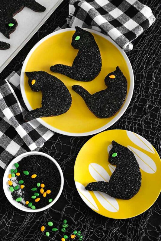 black cat cookies covered in sprinkles