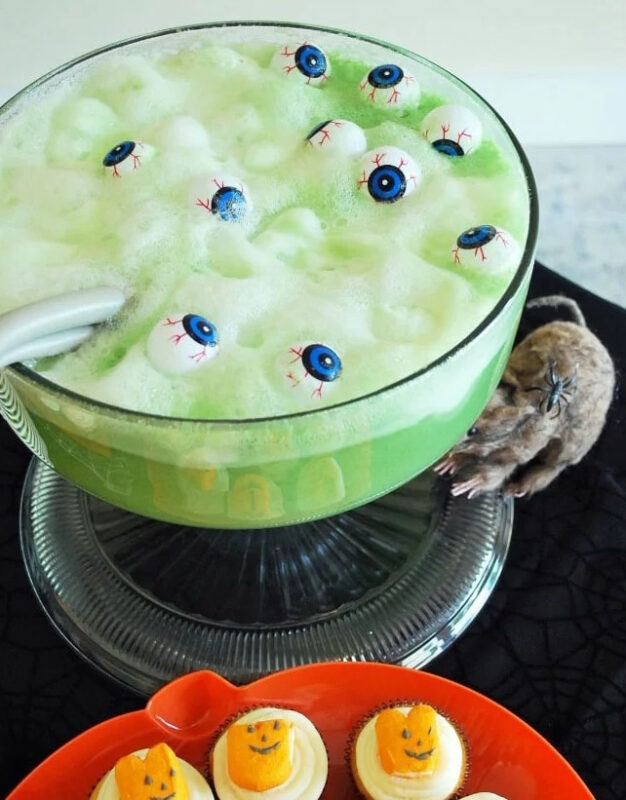 bowl of green punch with eyeballs