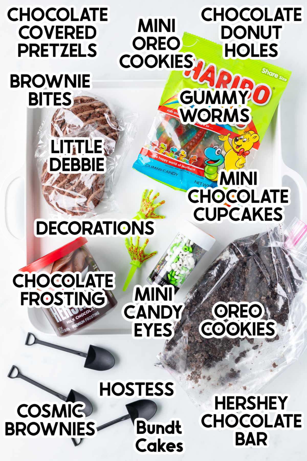 ingredients to make a halloween frosting board with labels
