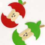 two apple crafts on a white background