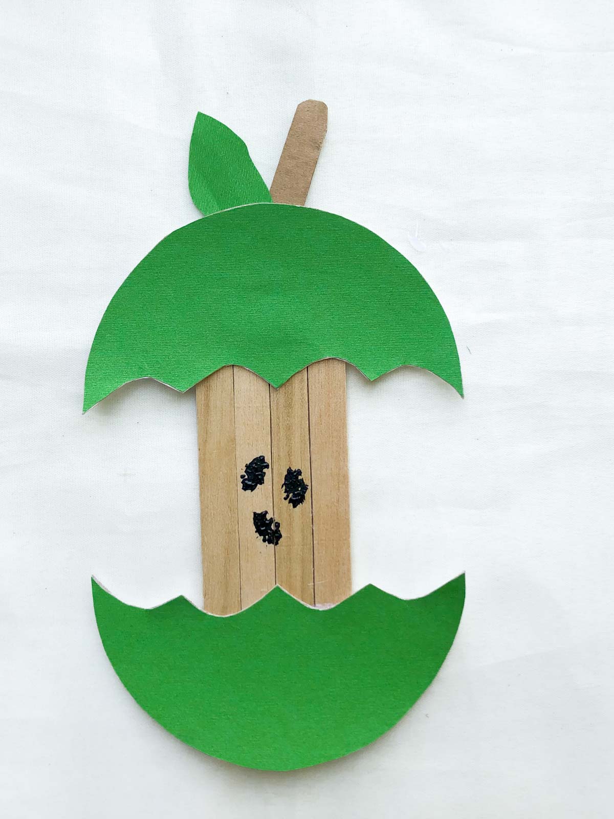 green apple craft with paper and popsicle sticks