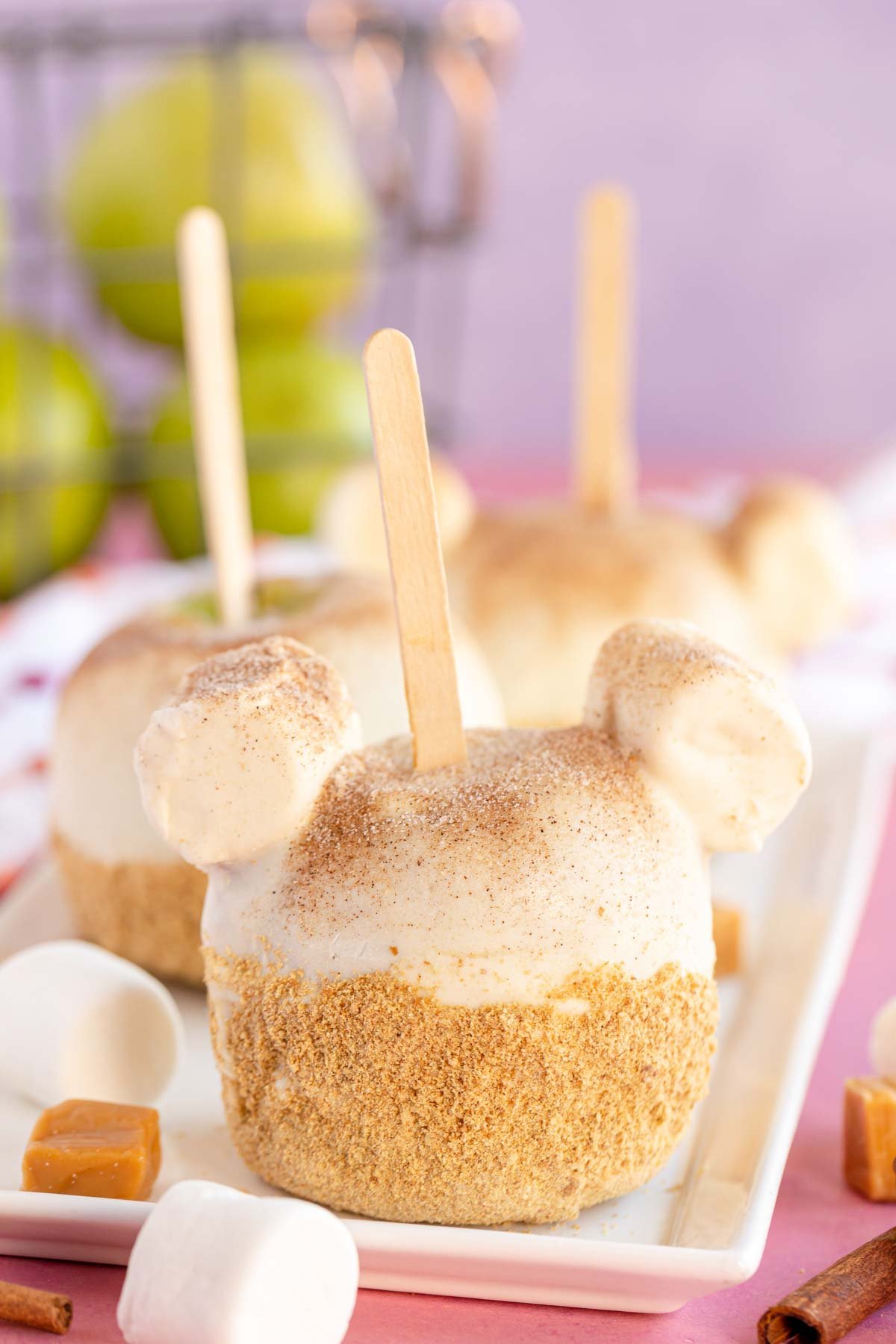 disneyland apple pie caramel apple on a white plate