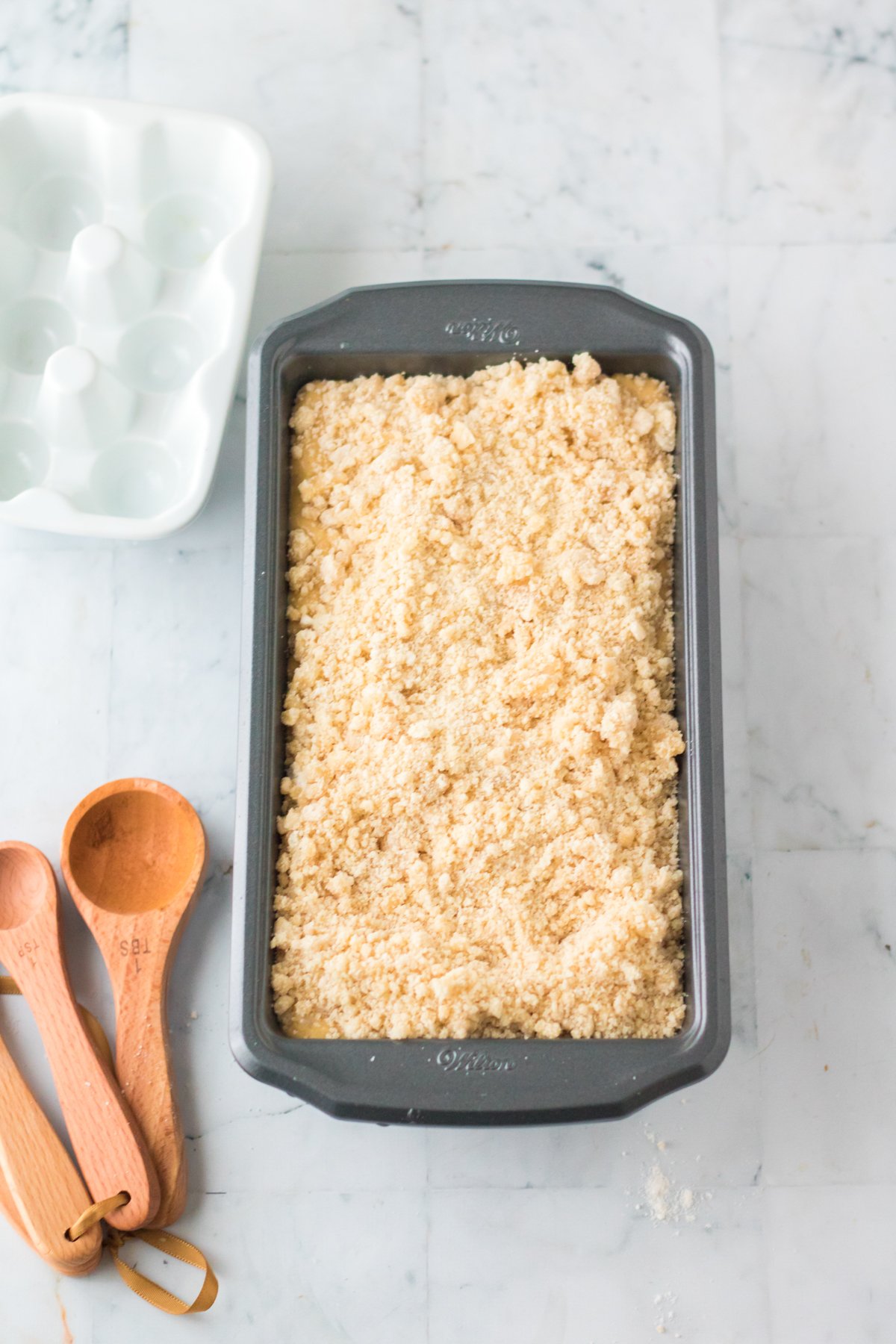 unbaked apple streusel cake in a baking pan