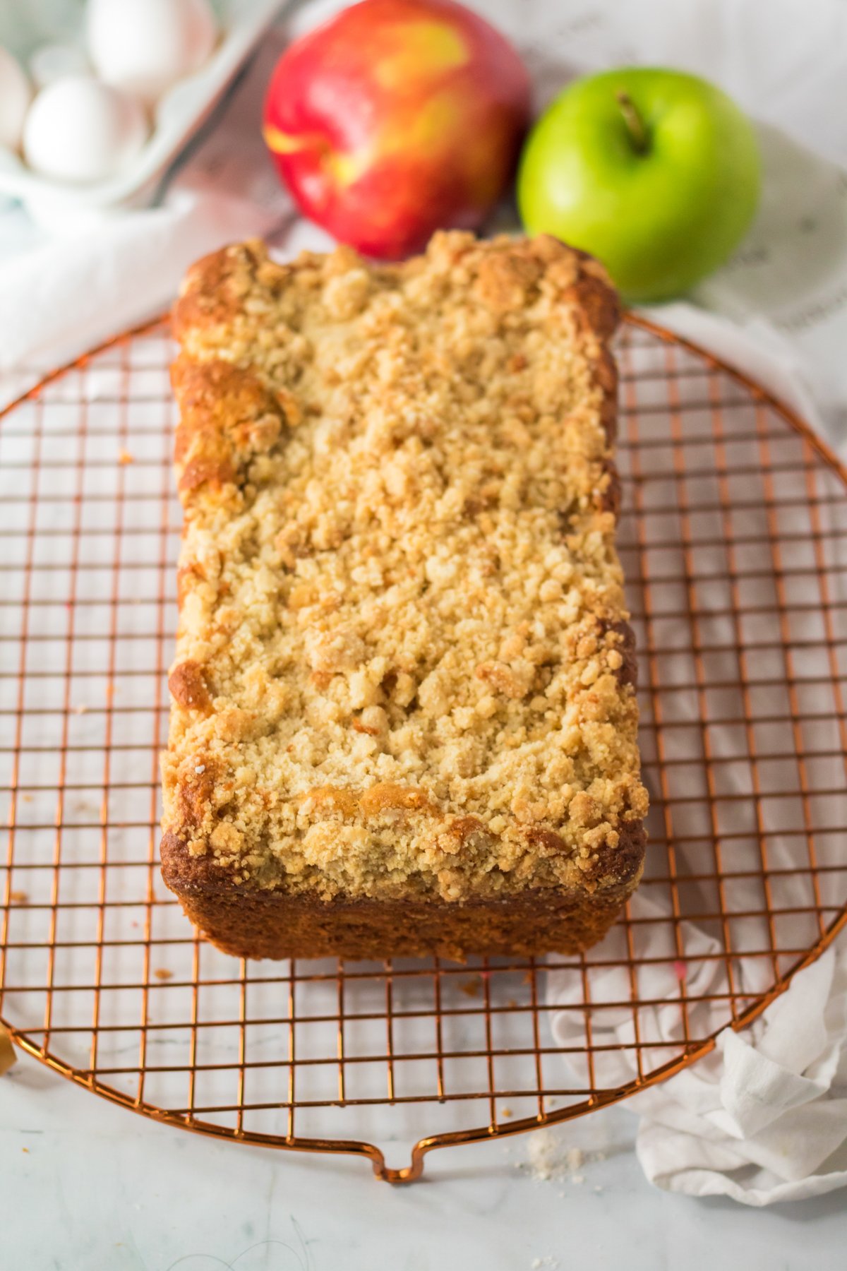 rectangle apple streusel cake on a cooling rack