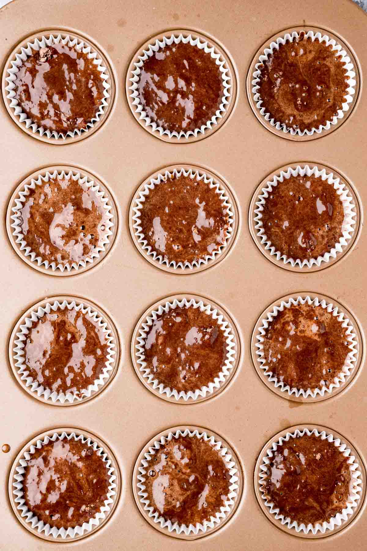 chocolate cupcake batter in muffin tins