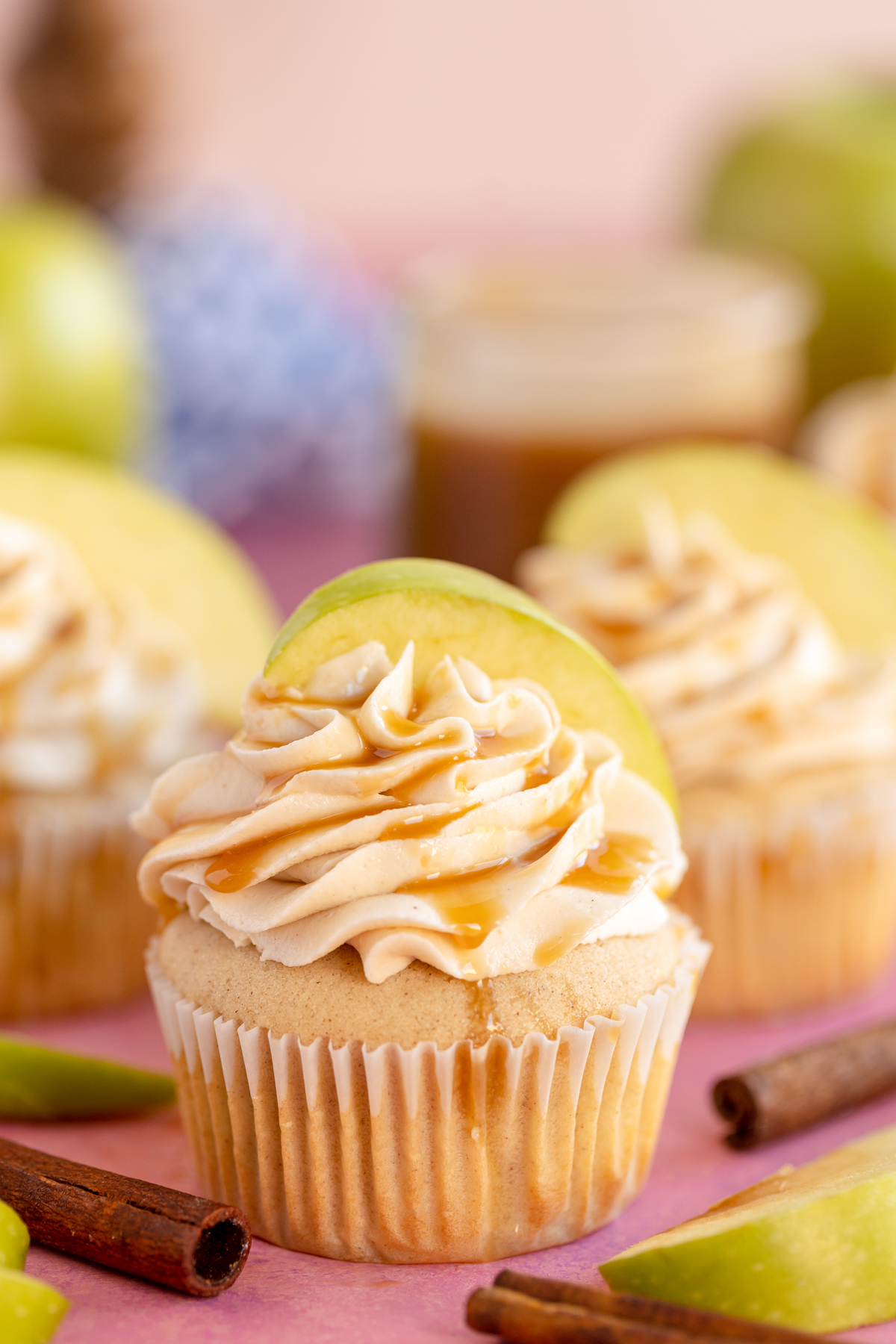 caramel apple cupcake with frosting and a caramel drizzle