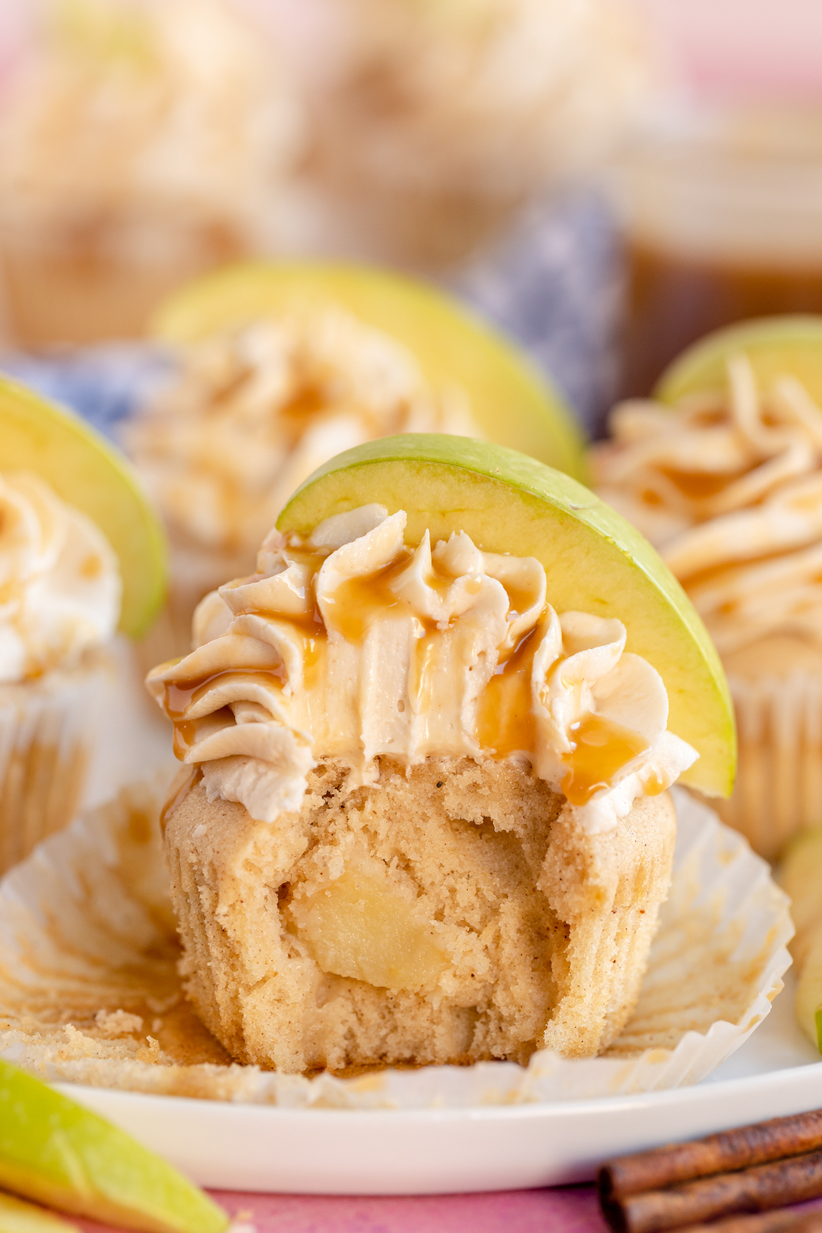 caramel apple cupcake with a bite out of it