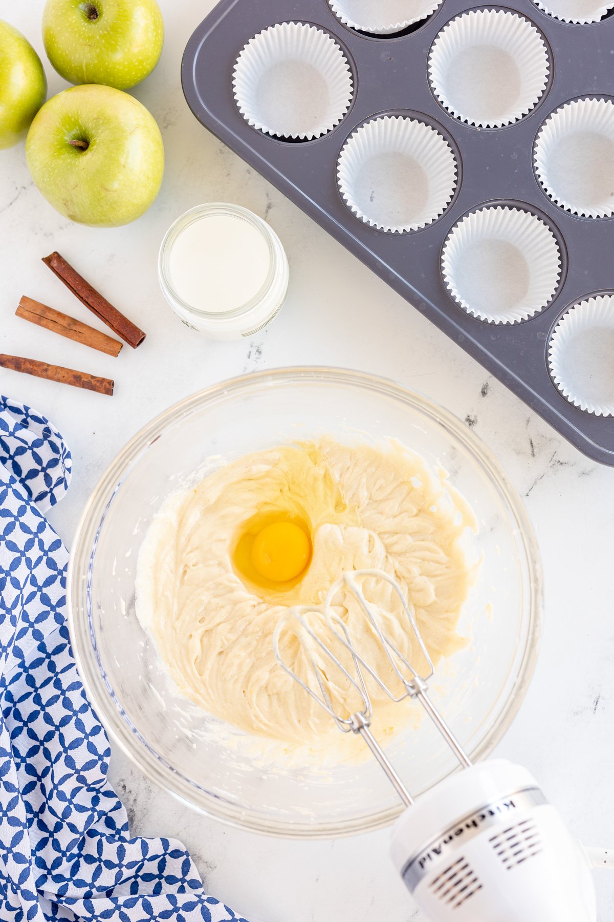 glass bowl with ingredients to make caramel apple cupcakes