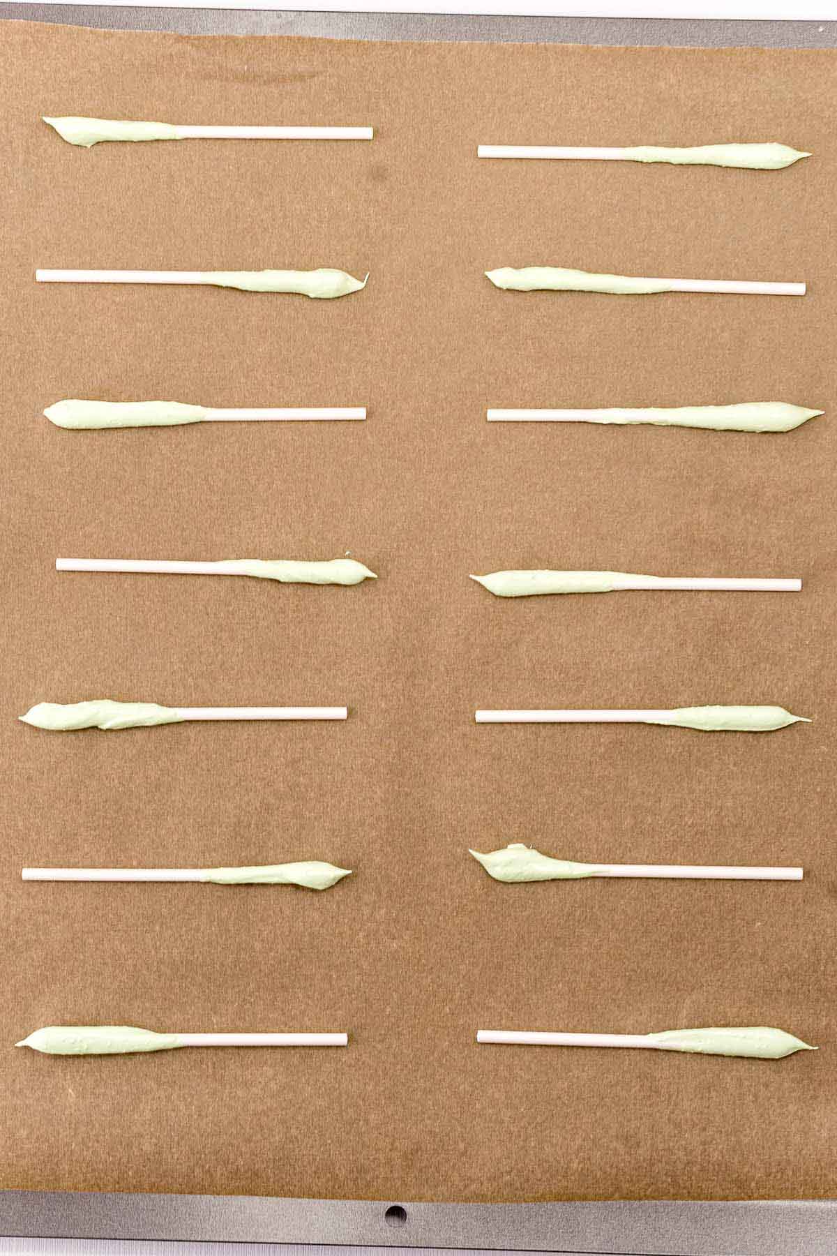 lollipop sticks on a piece of baking sheet