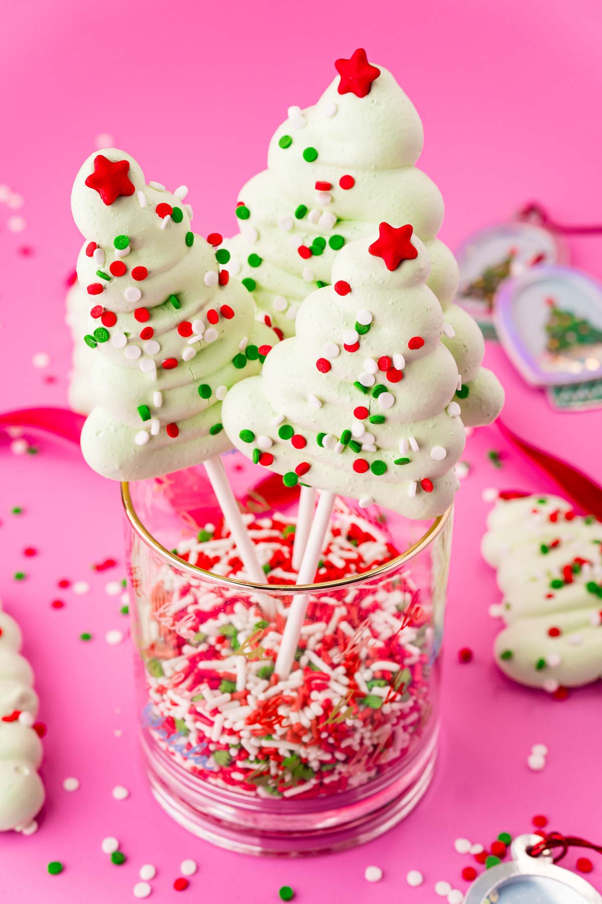 Christmas meringue trees on lollipop sticks in a cup