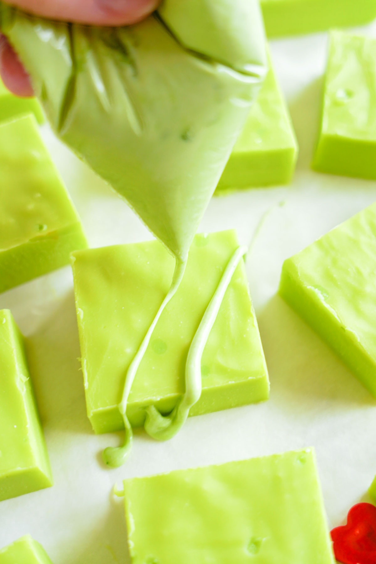piping bag drizzling onto grinch fudge