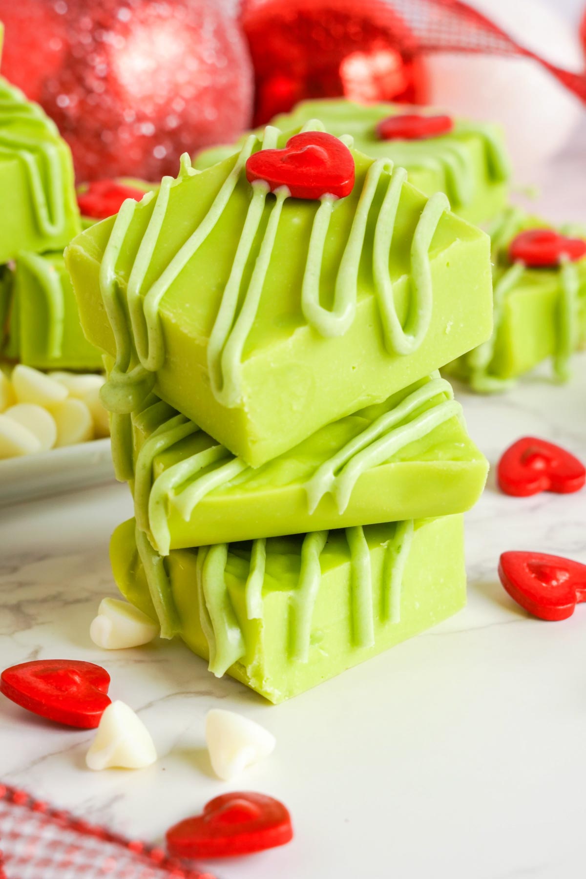 pieces of Grinch fudge stacked on top of each other