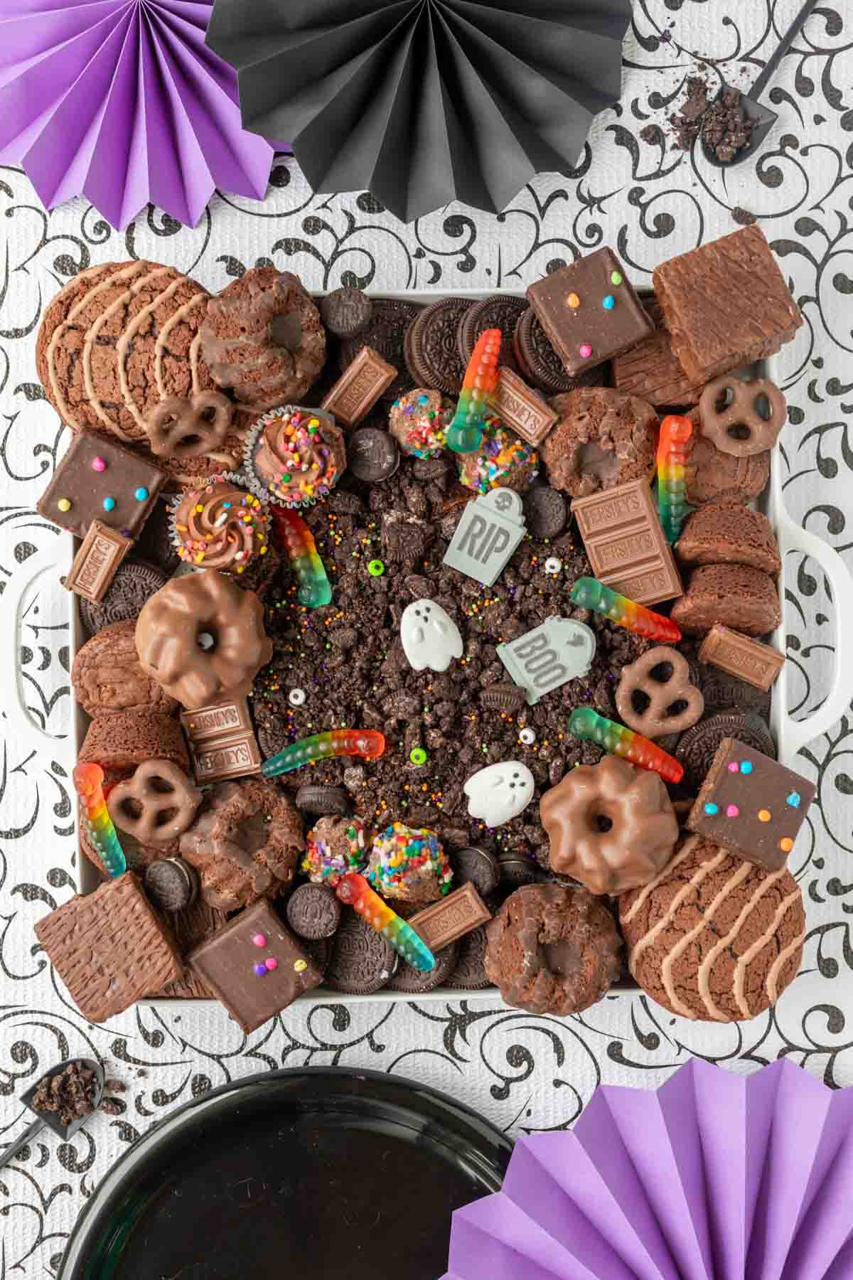 Halloween frosting board with dirt and worms