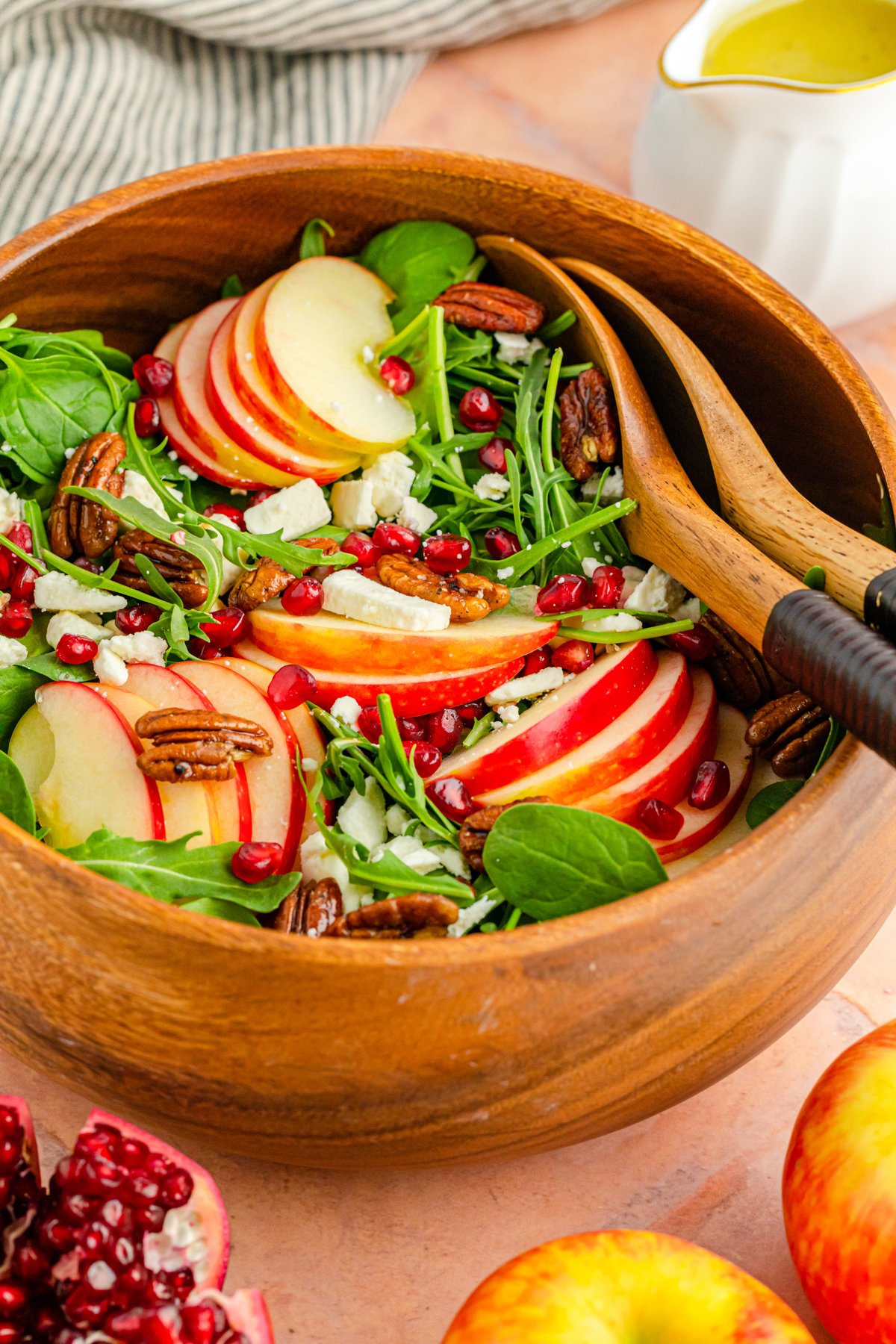 brown bowl with a pomegranate feta salad