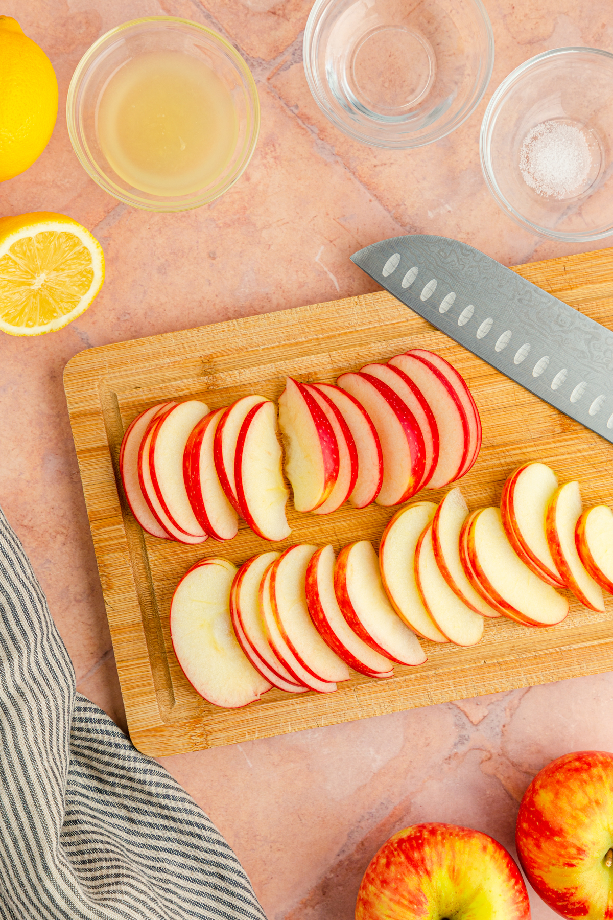 cutting board with sliced apples