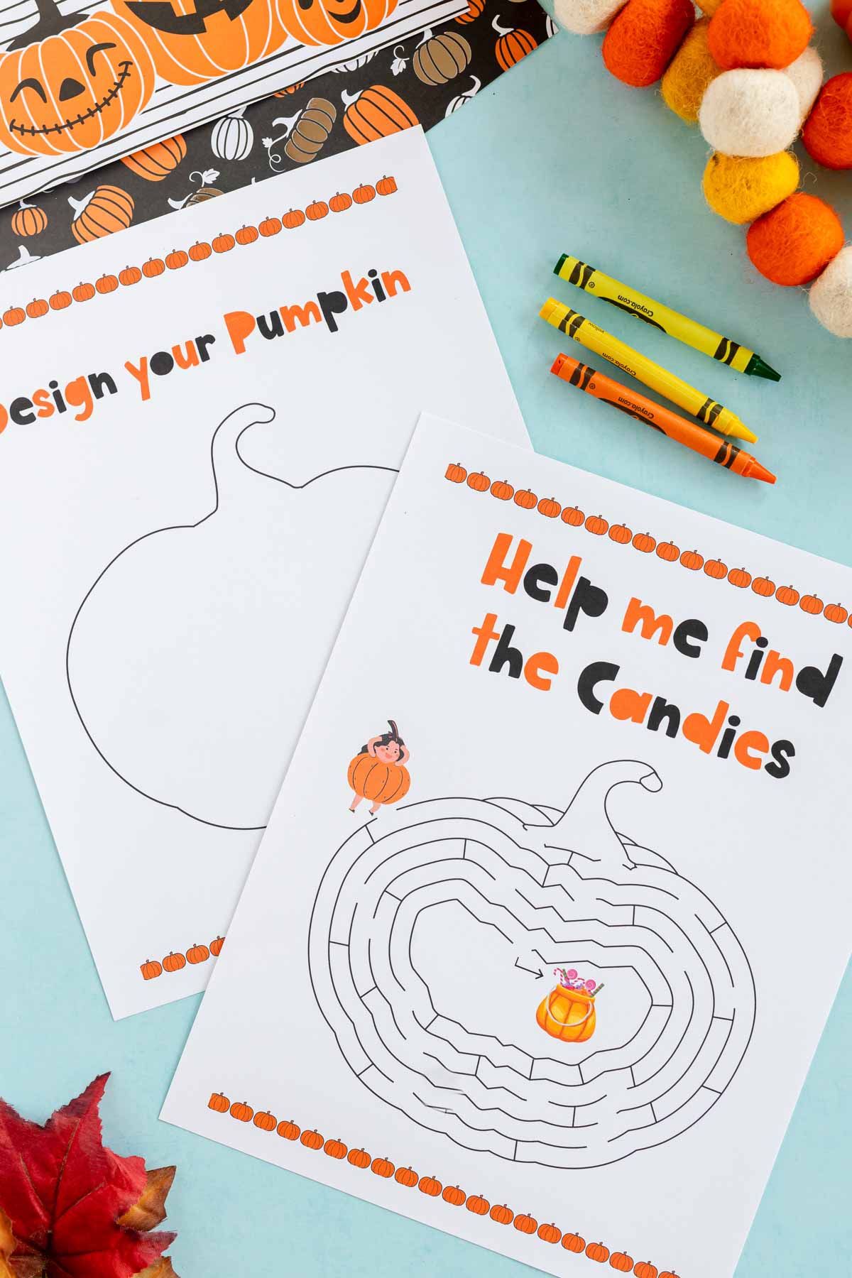 two pumpkin worksheets with crayons