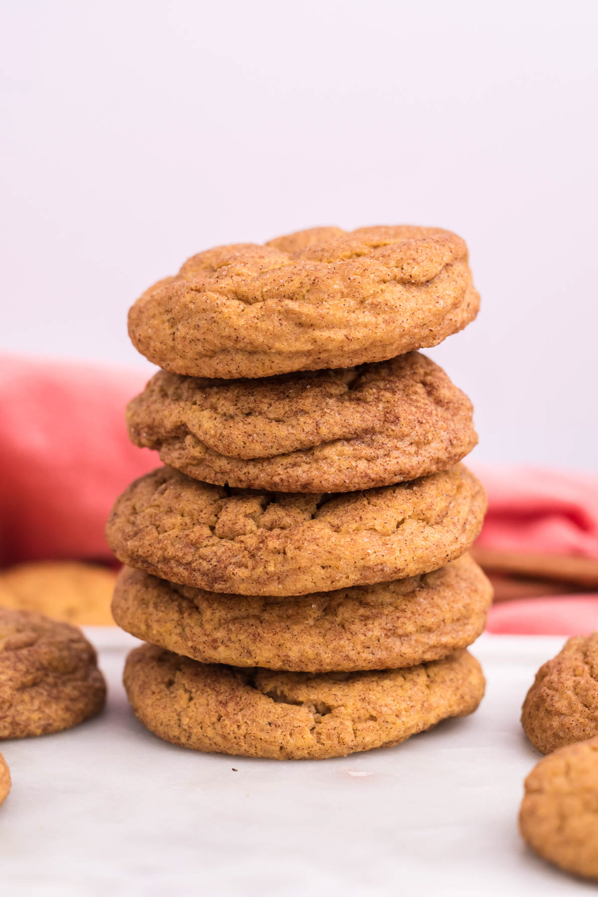 stack of chewy pumpkin snickerdoodles on top of each other