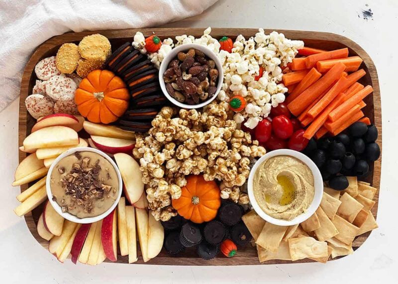 snacking board with orange and white colors