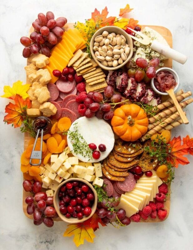 fall colored board with seasonal snack items
