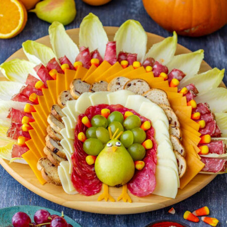 pear turkey body with crackers cheese and meat feathers