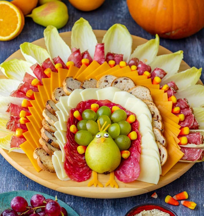 pear turkey body with crackers cheese and meat feathers