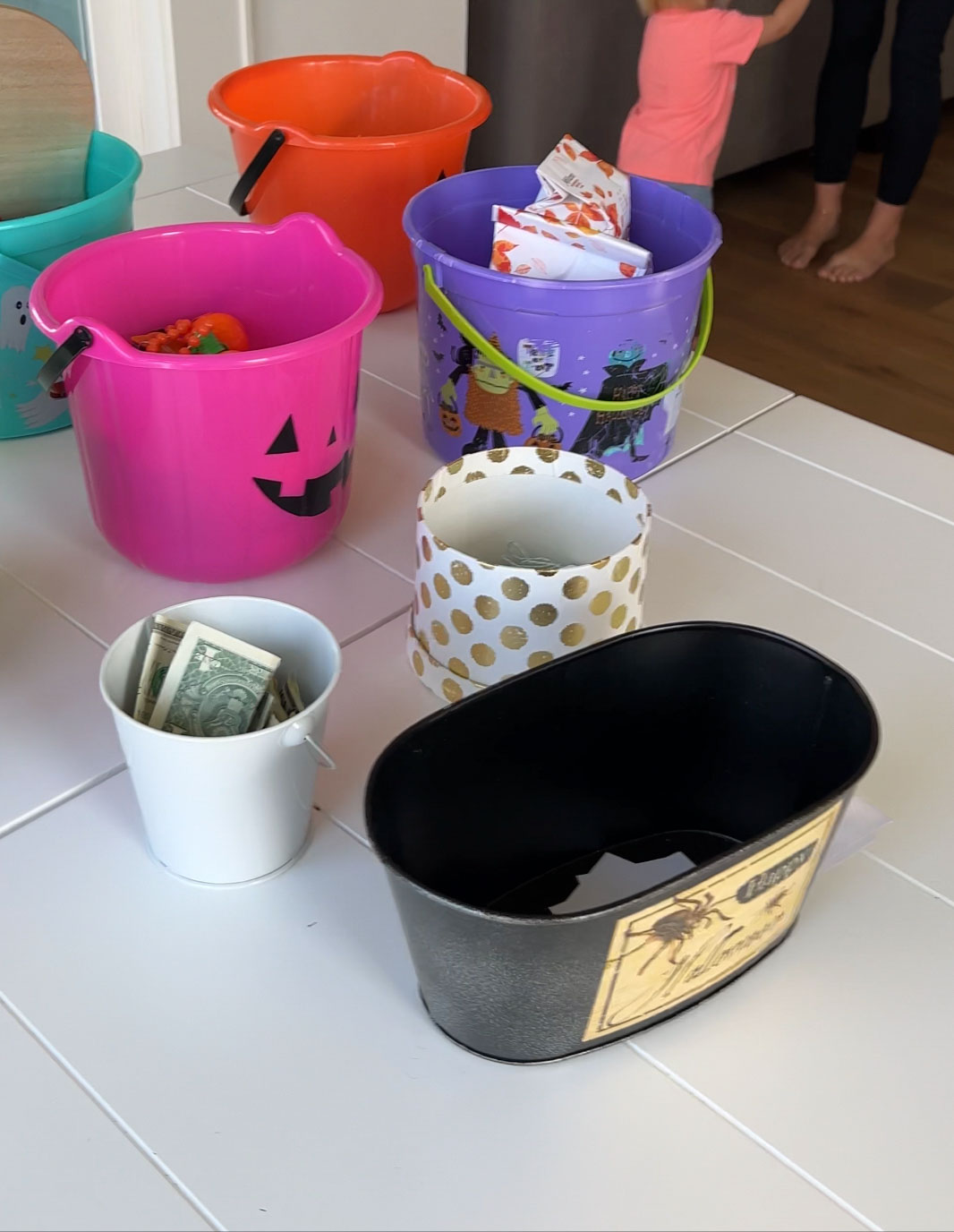 Halloween buckets with cash and candy