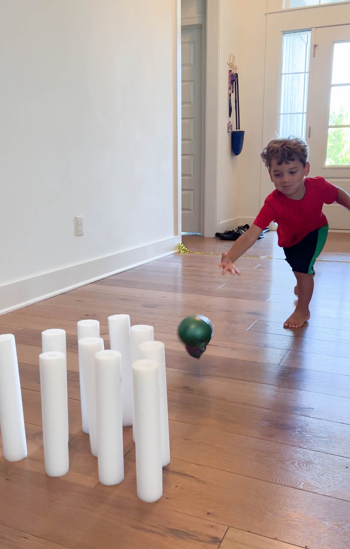 kid playing a ghost bowling game