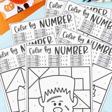 Halloween color by number pages stacked on top of each other