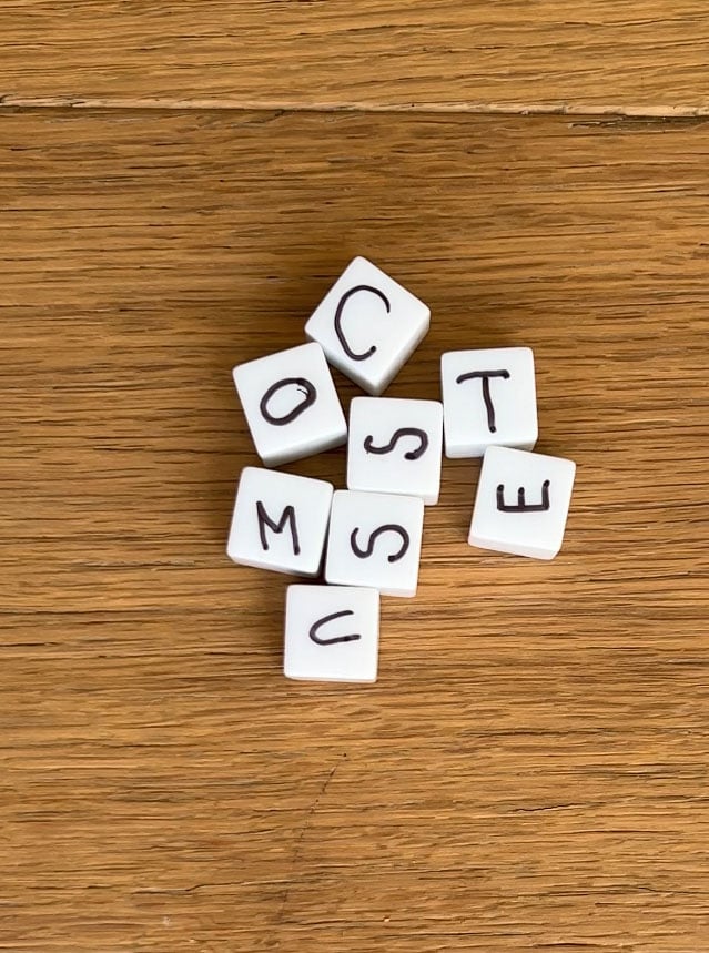 blank white dice with letters on them