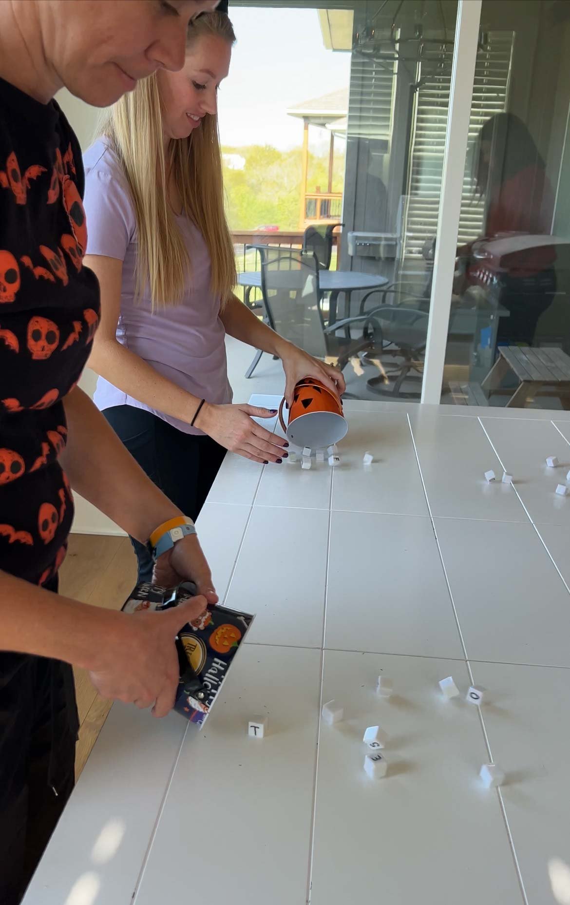 woman rolling a bucket of dice