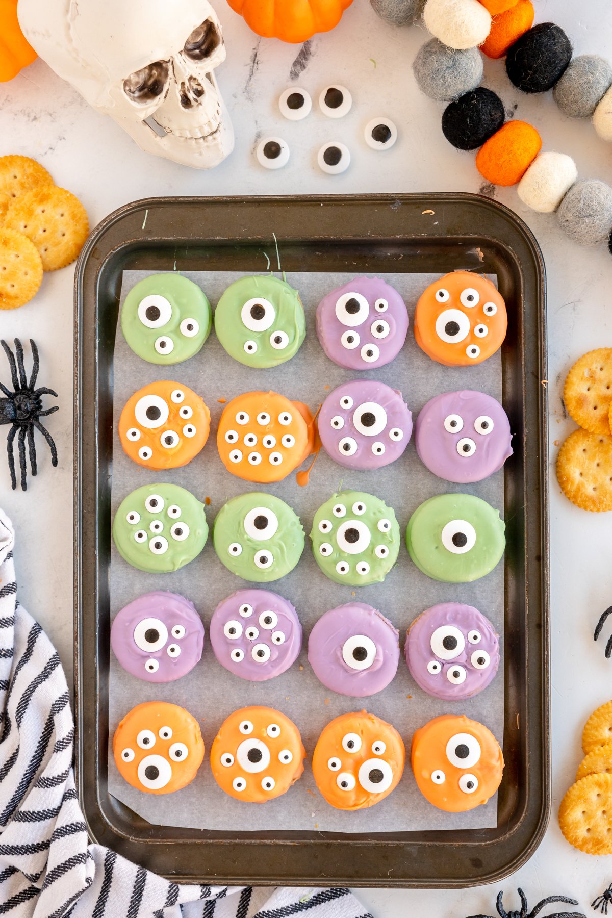 baking sheet with monster snacks lined up on it