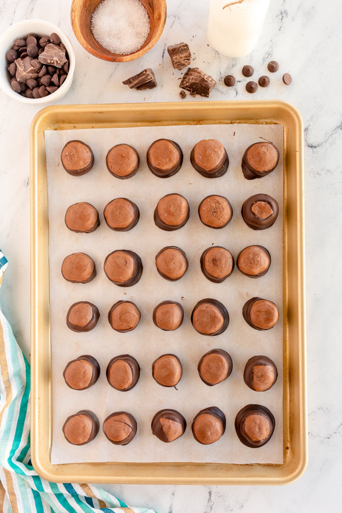 baking sheet full of dipped nutella buckeyes