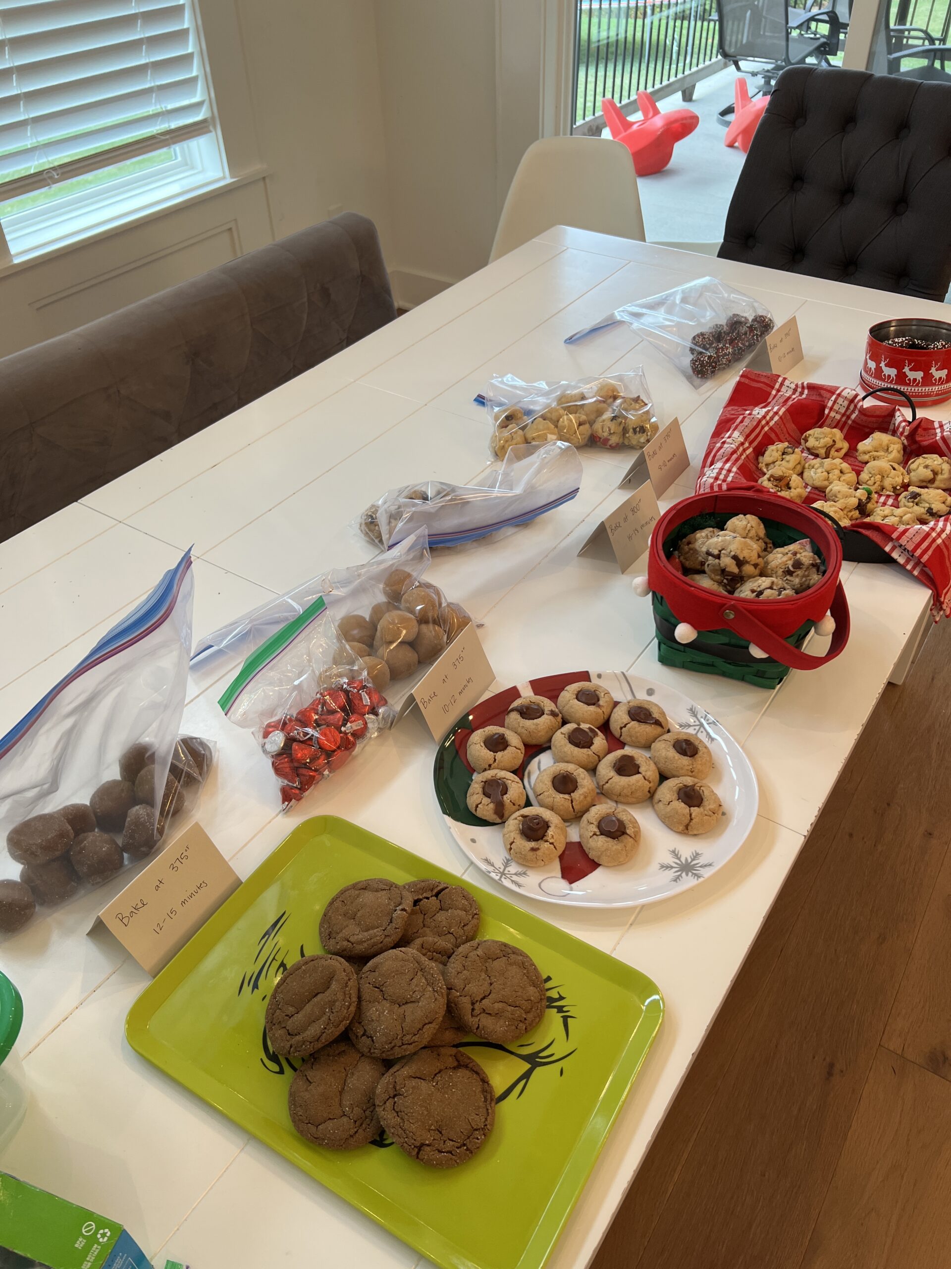 table set with cookies and cookie dough for a holiday cookie exchange