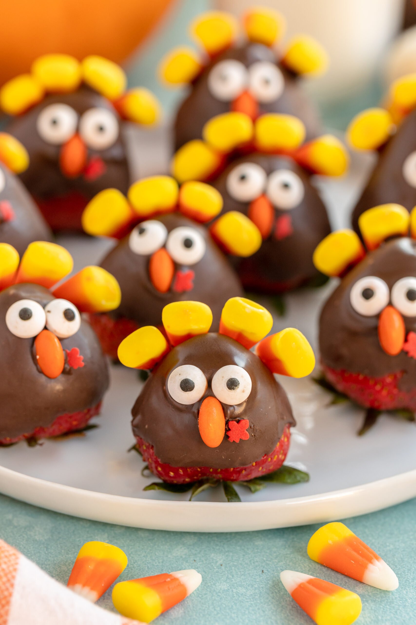 white plate filled with chocolate covered strawberry turkeys