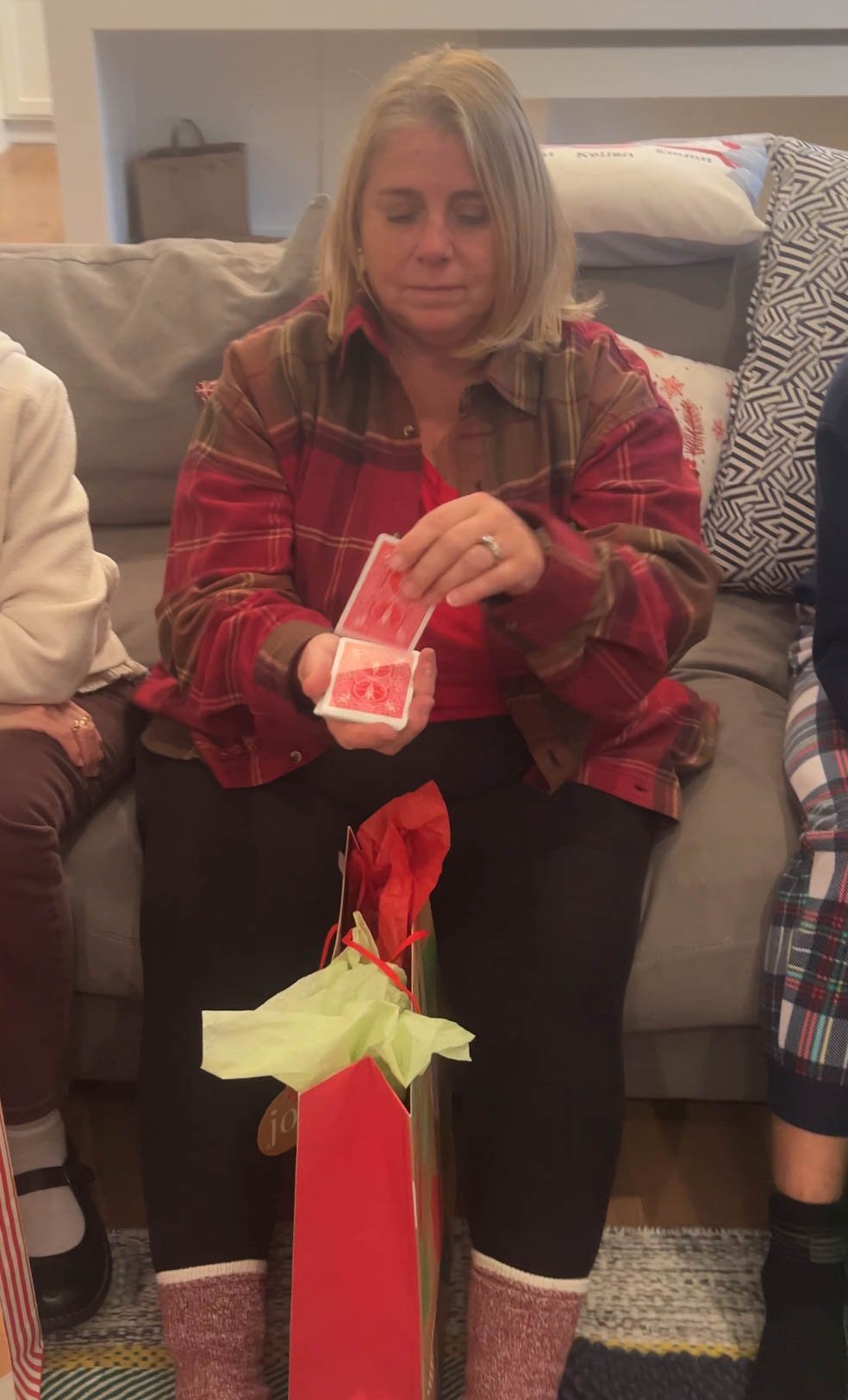 woman flipping a card off the top of a deck