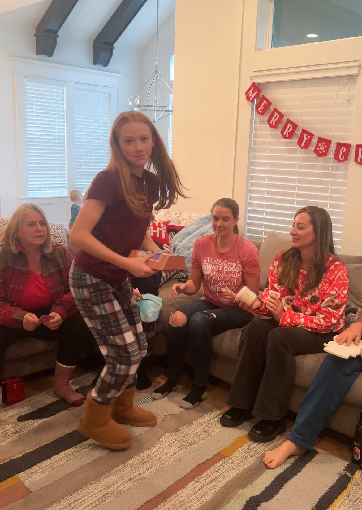girl stealing a gift from her mom in a gift exchange