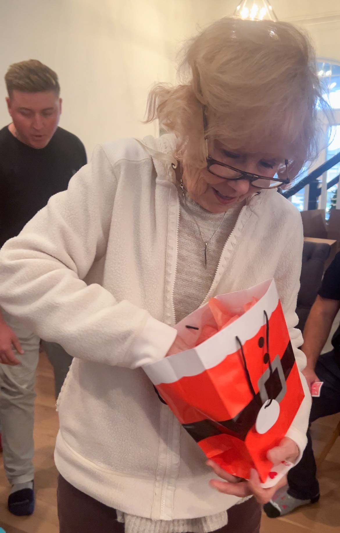 grandma opening a santa bag